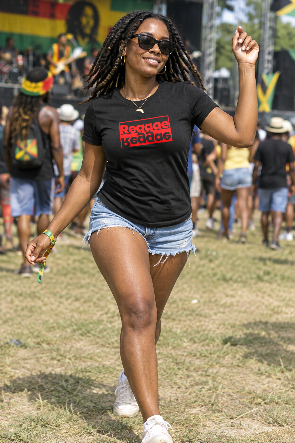 Woman in a black Reggae T-shirt walking through a Jamaica music festival